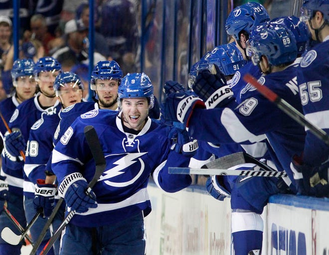 Tampa Bay Lightning center Tyler Johnson (9) celebrates with teammates after scoring against the Detroit Red Wings during the second period in Game 2 in the first round of the NHL hockey Stanley Cup playoffs, Saturday, April 18, 2015, in Tampa, Fla. (Dirk Shadd/The Tampa Bay Times)