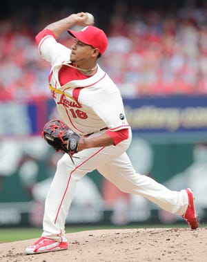 The St. Louis Cardinals' Carlos Martinez pitches in the second inning of a baseball game against the Cincinnati Reds, Saturday, April 18, 2015 in St. Louis. (AP Photo/Tom Gannam)