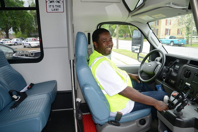 Marlin Witherspoon, driver for Lenoir County Transit, poses for a photo behind the wheel of a transit bus Friday morning.