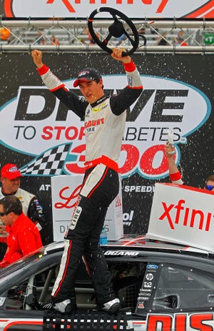 Driver Joey Logano celebrates in Victory Lane after winning the NASCAR Xfinity Series auto race at Bristol Motor Speedway on Saturday, April 18, 2015, in Bristol, Tenn. (AP Photo/Wade Payne)