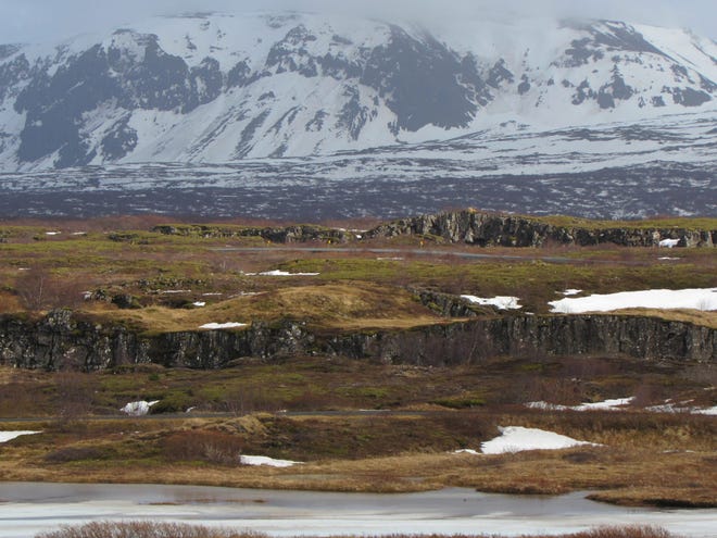 The broad vistas at Thingvellir National Park extend to snow-capped mountains and basalt cliff faces. The locale was the spot where the first Icelandic Parliament convened, in 930. (George Borecky )