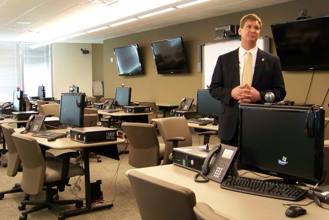 This March 9, 2012, file photo shows FBI spokesman Kyle Loven giving a tour of the Emergency Operations Center at the new Minneapolis-area field office in Brooklyn Center, Minn.