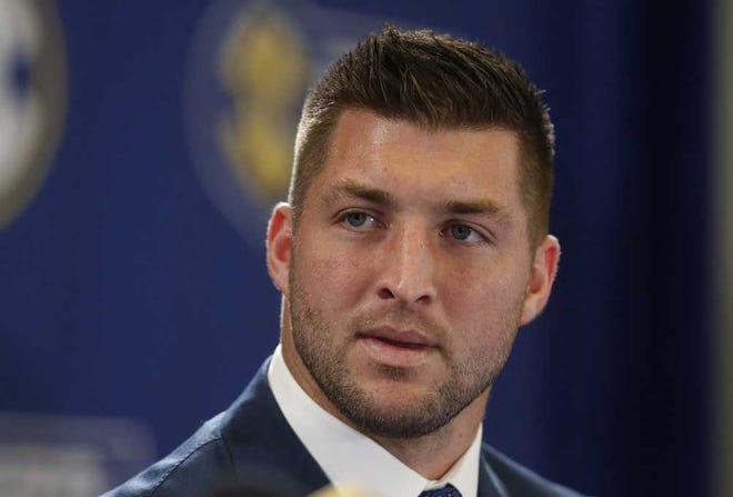 FILE - In this Dec. 5, 2014, file photo, Tim Tebow speaks during an SEC television broadcast in Atlanta. Tebow is expected to sign a one-year contract with the Philadelphia Eagles on Monday, April 20, 2015 according to three people familiar with the deal. (AP Photo/Brynn Anderson, File)