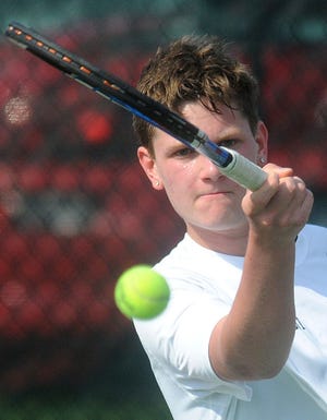 William Tennent's Dave Archut swats a forehand during his match against Archbishop Wood's Pete Nesseus on Tuesday, April 21, 2015 at William Tennent.