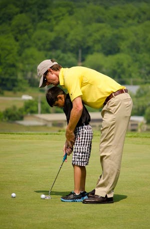 Submitted Photo - Sean Hogan, director of instruction at the Leadbetter Golf Academy at Crystal Springs, coaches a young golfer.