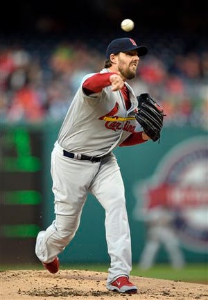 St. Louis Cardinals starting pitcher John Lackey throws to a Washington Nationals batter during the first inning of a baseball game, Wednesday, April 22, 2015, in Washington. (AP Photo/Nick Wass)