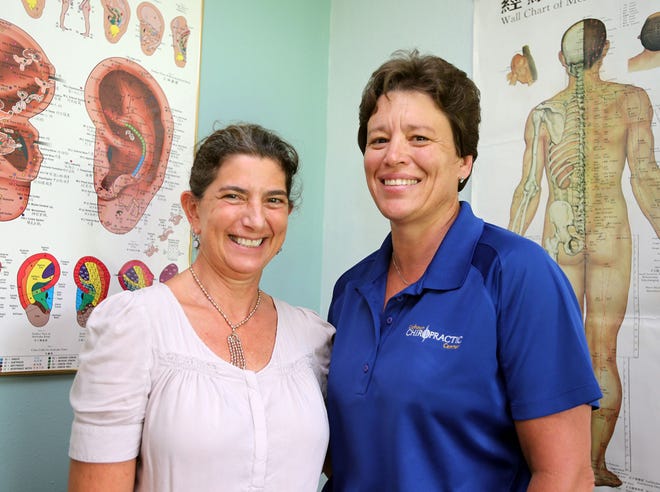 From left, Drs. Anaya Palay and LisaCalhoun are seen at Calhoun Chiropractic Center in Panama City Beach on Monday.