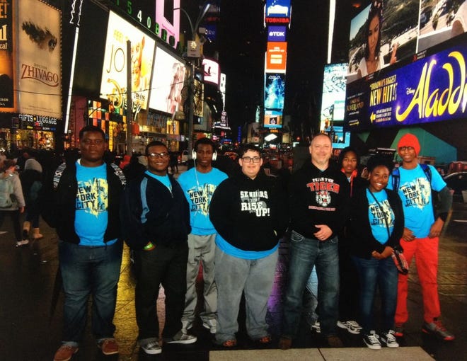 DHS Air Force JROTC sergeant and cadets stand in the Times Square on their visit to New York City earlier this month.