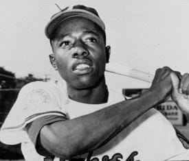 On April 23, 1954, Hank Aaron of the Milwaukee Braves hit the first of his 755 major-league home runs in a game against the St. Louis Cardinals.