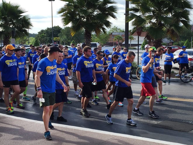 The local Law Enforcement Torch Run gets underway again after stopping at the Publix at Churchill Square in Ocala Thursday morning.