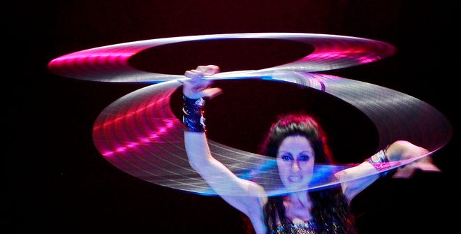 Showgirl Daniela performs with hoops during past peformances of Extreme Vegas. The show features grand illusions, high-energy stunts and showgirls.