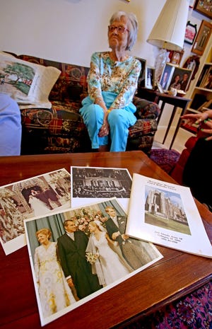 Photos from Tricia Nixon Cox's wedding sit on a coffee table at Rieta Maxwell's home, in Shelby, as she recalls memories.