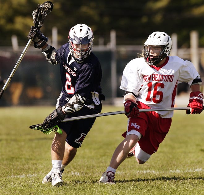 Apponequet's Tory Nanfelt, left, has been setting the tone for the Lakers' boys lacrosse team. MIKE VALERI/THE STANDARD-TIMES