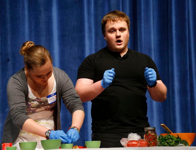 At this point in their salsa demonstration, Zach Moline was doing the talking and sister Sierra was doing the making. The siblings are students in Braintree High's course in public speaking. The photo was taken on Tuesday, April 14, 2015.