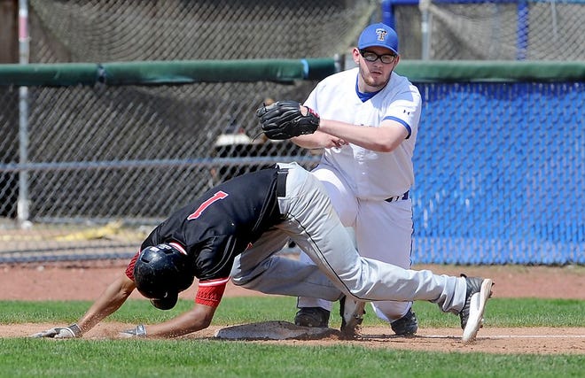 Timken third baseman Matt Sigley tags out McKinley's Isaiah Hogsett who had attempted to advance first-to-third on a soft line drive hit during the April 18 meeting between the teams.