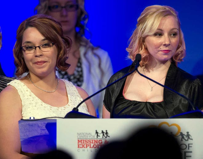 Kidnapping survivors Gina DeJesus, left, and Amanda Berry are honored at the 2014 National Center for Missing and Exploited Children's Hope Awards dinner in Washington. For years, the two women and a third, Michelle Knight, were held captive in a Cleveland home by Ariel Castro before finally escaping in 2013. They were bound with heavy chains and subjected to repeated rapes and other abuse. Now Berry and DeJesus have written a book about their experiences, "Hope: A Memoir of Survival in Cleveland," which is scheduled to come out Monday, April 27, 2015. (AP Photo/Cliff Owen, File)