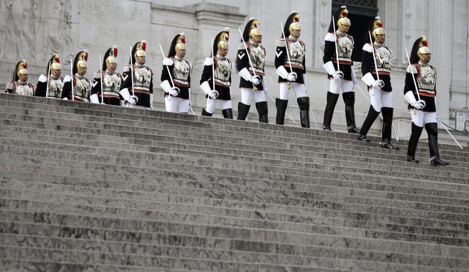Cuirassier presidential guards descend the steps of the monument to the unknown soldier during a ceremony to mark Italy’s Liberation day, in Rome Saturday, April 25, 2015. Italy is celebrating the 70th anniversary of a partisan uprising against the Nazis and their Fascist allies at the end of World War II. President Sergio Mattarella marked Liberation Day on Saturday by laying a wreath on the tomb of the unknown soldier in Rome. The anniversary marks the day in 1945 when the Italian resistance movement proclaimed an insurgency as the Allies were pushing German forces out of the peninsula.