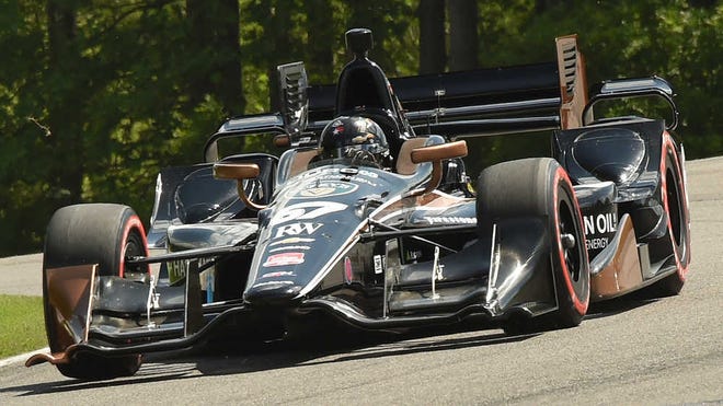 Josef Newgarden, who grew up just a few hours away from Birmingham, Ala., held off Graham Rahal on Sunday to earn his first IndyCar victory at Barber Motorsports Park.