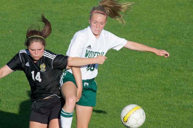 Evans' Hannah Davall (left) and Greenbrier's Cici Capps collide during their playoff game at Blanchard Woods Park on April 20, 2015. Photo by Jim Blaylock
