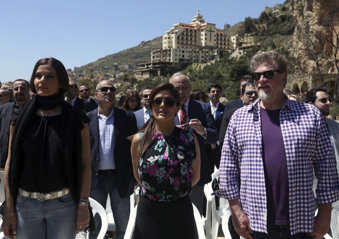 AP Photo/Bilal Hussein Mexican and American actress Salma Hayek, center, Lebanese legislator Setrida Geagea, left, and film director Roger Allers, right, stand for the Lebanese and Mexican national anthems during her visit at the museum of the famed Lebanese-born poet and philosopher Khalil Gibran in the northeast mountain town of Bcharre, Lebanon, Sunday, April 26, 2015. Hayek visited her ancestral homeland Lebanon to launch her latest film andquot;The Prophet,andquot; a screen adaptation of the book by the same name written nearly a century ago by Gibran.