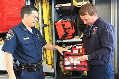 Police Chief and Public Safety Director Michael Yaniero talks to Capt. E. B. Tallman of Fire and Emergency Services recently about the drug Narcan, which reverses the effects of opioids. The state recently authorized law enforcement to carry the drug.