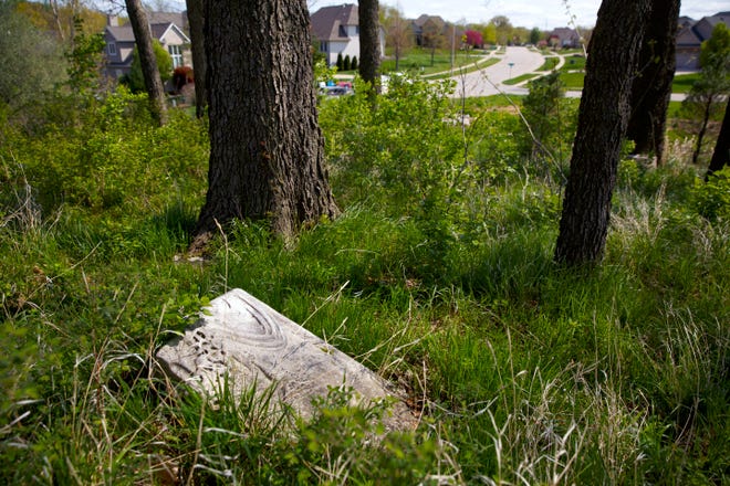 Grave markers dating to the mid-1800s are strewn on the ground in Bridges Cemetery, which is in the Piper Glen subdivision. The cemetery was photographed Wednesday, April 22, 2015. Rich Saal/The State Journal-Register