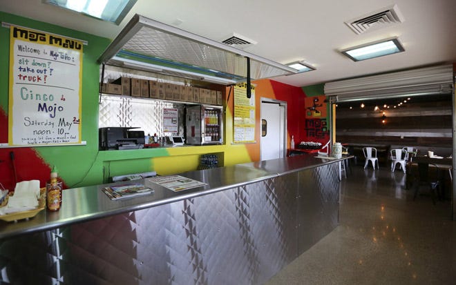 The carryout section at the Mojo Tago restaurant mimics the look and feel of its food trucks.