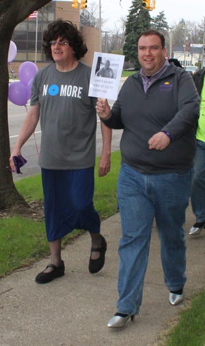 Radio personality Jim Whelan and Bronson City Manager Mark Heydlauff walk a mile in support of the NoMore violence.