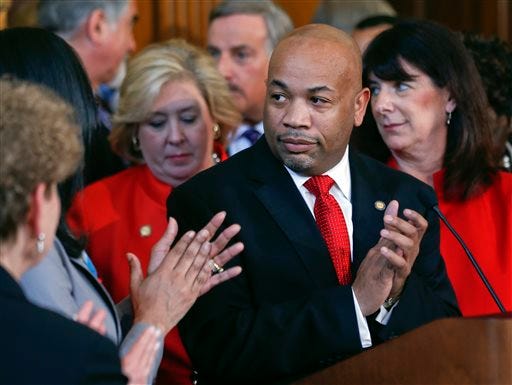 Assembly Speaker Carl Heastie, D-Bronx, applauds at the end of a news conference on equal pay legislation at the state Capitol on Monday, April 27, 2015, in Albany, N.Y. The Assembly is set to give final approval to closing loopholes law guaranteeing equal pay for women.