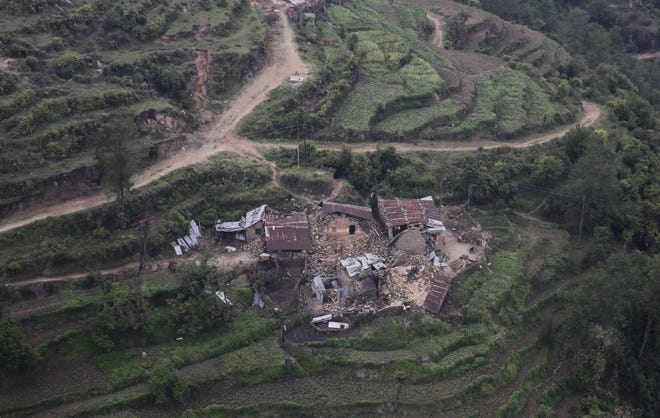 An aerial view of residential buildings damaged Saturday’s earthquake at Trishuli Bazar in Nepal, Monday, April 27, 2015.