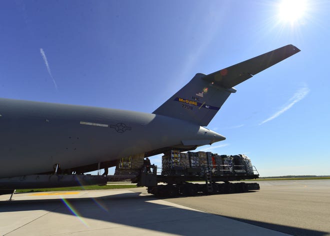 U.S. Air Force Airmen load a C-17 Globemaster III with approximately 70,000 pounds of equipment and supplies for the Fairfax County Urban Search and Rescue Team on Sunday, April 26, 2015, at Dover Air Force Base in Delaware. The 69-member team is deploying to Nepal to assist with rescue operations after the country was struck by a 7.8-magnitude earthquake.