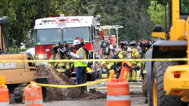 Firefighters at the scene of a gas leak on Grace Avenue off 10th Avenue North Tuesday morning, April 28 2015. (Lannis Waters / The Palm Beach Post)