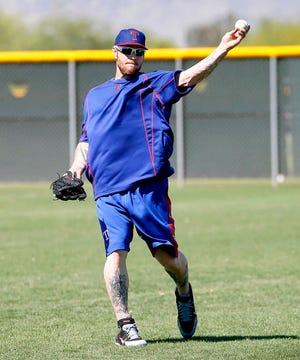 Texas Rangers baseball player Josh Hamilton works out at the Rangers' training facility, Tuesday, April 28, 2015, in Surprise, Ariz. (AP Photo/Matt York)
