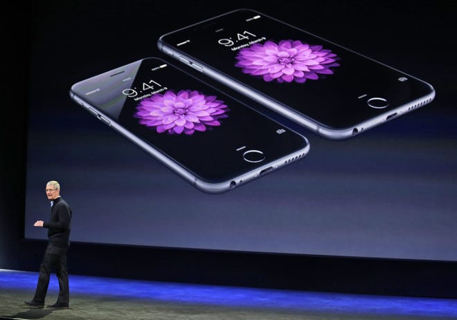 Apple CEO Tim Cook talks about the iPhone 6 and iPhone 6 Plus during an Apple event last month in San Francisco.