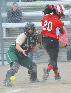 BRIAN D. SANDERFORD • TIMES RECORD Northside’s Sydney Green, right, rounds the bases after a hit and a couple of throwing errors allow her to score passed Alma catcher Makayla Lewis on Monday, April 27, 2015 in Alma. Northside won the game 13-4. 
 BRIAN D. SANDERFORD • TIMES RECORD Northside’s Jaynee Alston catches an Alma flyball to center on Monday, April 27, 2015 in Alma. Northside won the game 13-4.