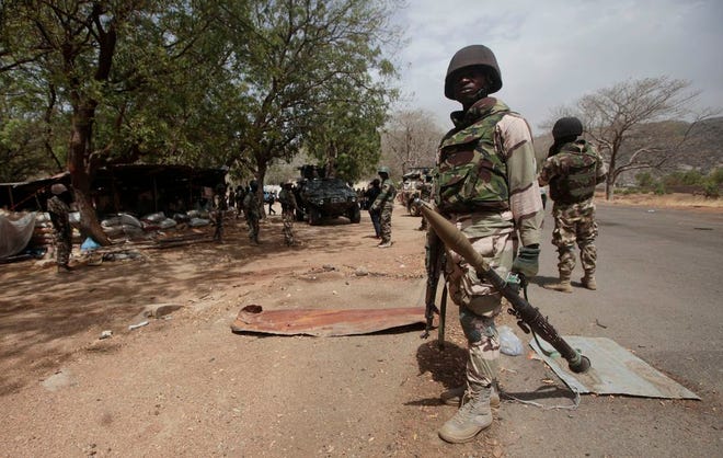 Nigerian soldiers at a check point in Gwoza, Nigeria, a town recently liberated from Boko Haram.