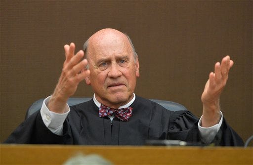 Fulton County Superior Court Judge Jerry Baxter presides over the sentencing of 10 of the 11 defendants convicted of racketeering and other charges in the Atlanta Public Schools test-cheating trial in Fulton County Superior Court, in Atlanta, Monday, April 13, 2015. Character witnesses are pleading for leniency as Baxter prepares to sentence most of the former Atlanta educators convicted in a widespread conspiracy to cheat on state tests. (Kent D. Johnson/Atlanta Journal-Constitution via AP, Pool)