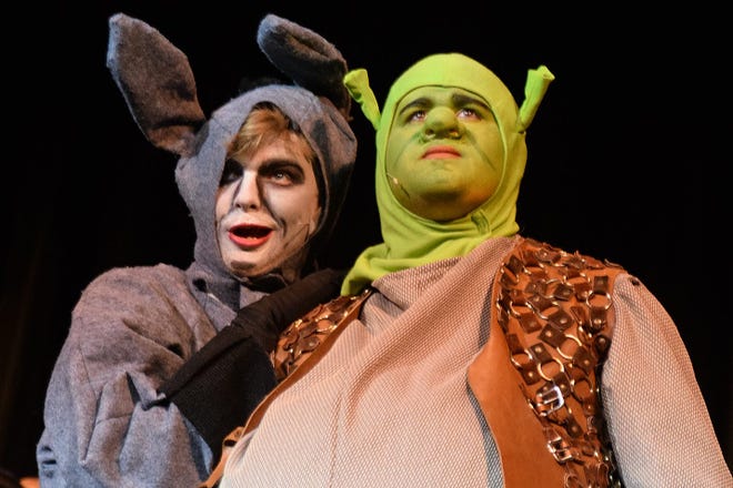 Shrek, played by Joey Lucero, looks toward the tower where Princess Fiona is held as Donkey, played by Graham Holmes, worries about meeting the fire breathing dragon guarding the tower. The Performing Arts Academy of Galesburg will be performing “SHReK the Musical” at the Orpheum Theatre at 7 p.m. Friday and Saturday and 2 p.m. Sunday. BILL NICE/The Register-Mail
