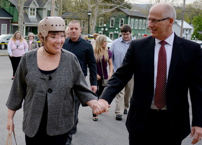 Sharon Budd, a Perry Local middle-school teacher from Stark County, Ohio, heads to a Pennsylvania courtroom Thursday with husband, Randy. They listened to testimony after which a judge ruled that three teenagers will be tried as adults in a rock-throwing incident last summer that severely injured her.