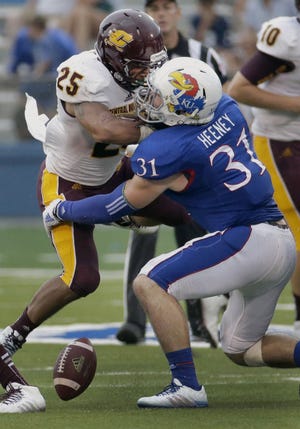 Kansas linebacker Ben Heeney forces a fumble last season against Central Michigan.