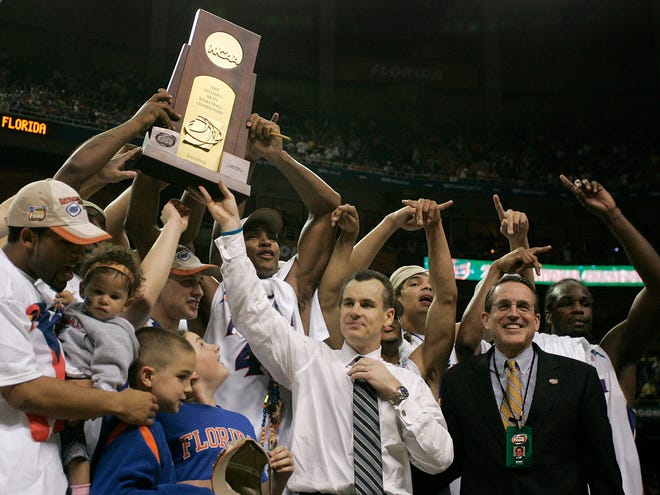 Coach Billy Donovan and the Florida Gators hoist the 2007 NCAA championship trophy after beating Ohio State, 84-75.