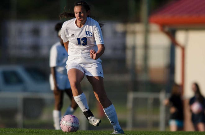 Oconee County's Carmen Pavao (13) dribbles down the field during a GHSA high school soccer playoff game between the Oconee County Warriors and the East Hall County Vikings in Watkinsville, Ga., on Thursday, April 30, 2014. The Warriors won 9-1. (Taylor Craig Sutton/Staff, Taylorcraigsutton.com)