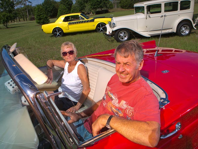 Kathy and Ed Steier sit in their red, all-stock 1957 Ford Thunderbird, just one part of their stable of classic vehicles.