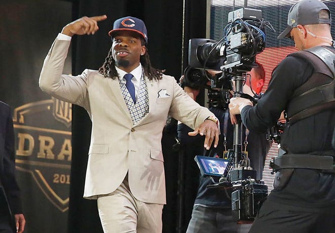 West Virginia wide receiver Kevin White celebrates after being selected by the Chicago Bears as the seventh pick in the first round of the 2015 NFL Draft, Thursday in Chicago.