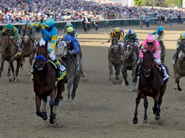 Victor Espinoza rides American Pharoah to victory in the 141st running of the Kentucky Derby at Churchill Downs on Saturday in Louisville, Ky. (/Jeff Roberson | Associated Press)