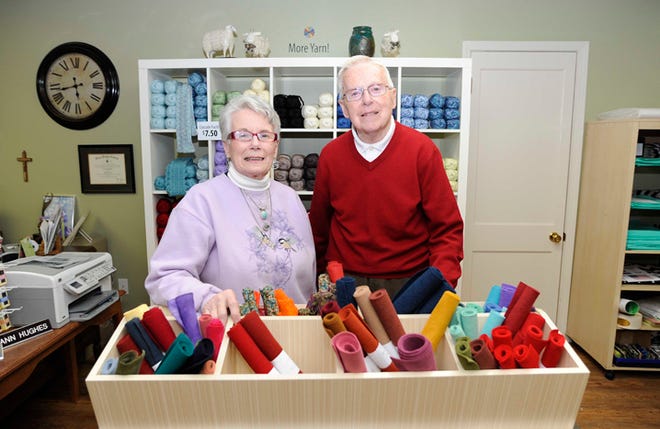 Ann's By Design owner Ann Hughes, left, and her husband, Phil, are seen in their newly opened shop in downtown Adrian.