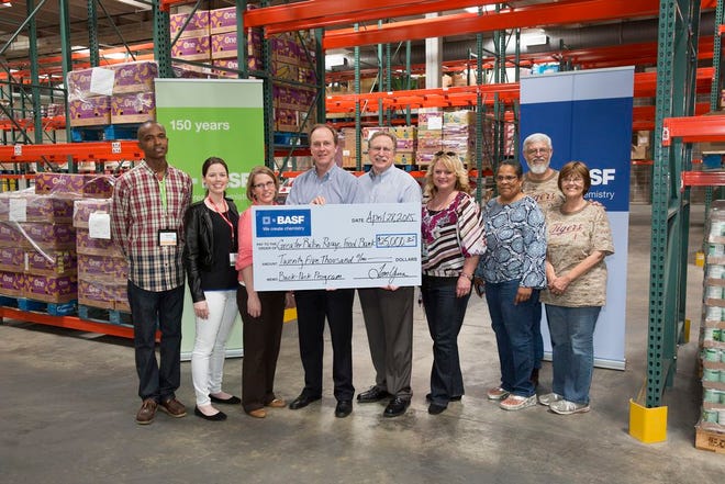 In recognition of BASF's 150th anniversary, the Geismar site donated $25,000 to the Greater Baton Rouge Food Bank to bring the BackPack child nutrition program to Ascension Parish. Pictured from left to right included BASF employee Randall Shoulders and Sasha Ipson; Kendall Hebert, Capital Area United Way’s Vice President of Communications; Tom Yura, BASF’s Senior Vice President and Site Manager at Geismar; Mike Manning, Greater Baton Rouge Food Bank’s President and Chief Executive Officer; Sherry Denig, Volunteer Ascension’s Executive Director; Gwen Hilliard Volunteer Ascension board member; John Langlois, BASF retiree, and his wife Charlotte Langlois.