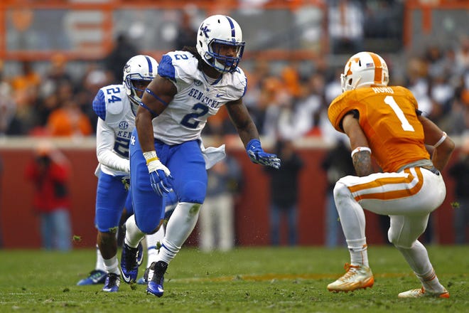 Kentucky defensive end Alvin Dupree (2) battles with Tennessee running back Jalen Hurd (1) during a game in November 2014 in Knoxville, Tenn.