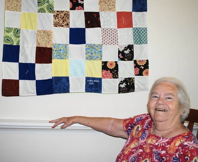 ALL SMILES — Coline Blake enjoys using her skills to make quilts. (Contributed photo) 
 COLORFUL CREATIONS — Carillon quilters and staff display the club’s work. From left, back, are Coline Blake, Lottie Stevenson, Beckie Johnson, Joyce ‘Annie’ Jessup, Shelley Thompson, Carole Bulla; front, Shirley Logsdon, Helen ‘Rachel’ Allred, Mary Potts. (Contributed photo) 
 CLASSIC — A nine patch quilt is the work of Lottie Stevenson. (Contributed photo) 
 SEW SPECIAL — Mary Potts puts her seamstress skills to good use with her quilt. (Contributed photo)