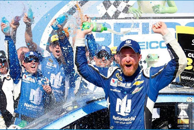 I WON! — Dale Earnhardt Jr. celebrates in victory lane after winning 
Sunday’s NASCAR Sprint Cup Series GEICO 500 at Talladega.